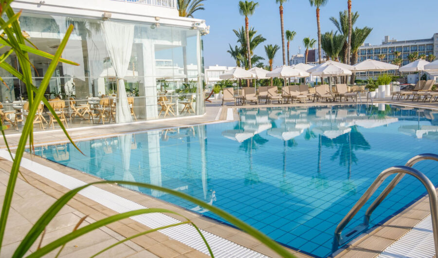 Bar of Infinity Blu with view of pool and sunbeds