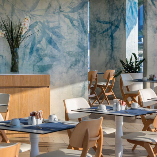 Tables at Infinity Blu restaurant prepared for lunch