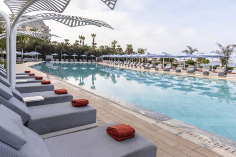 Sunbeds near the pool of Ivi Mare