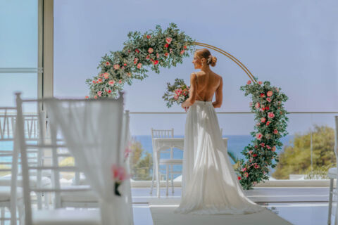 Bride preparing for wedding and admiring decorations