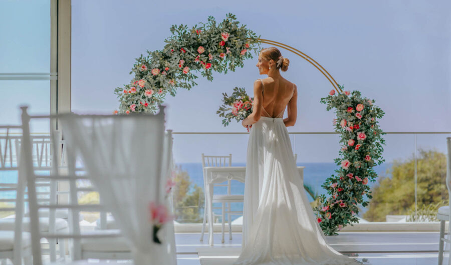 Bride preparing for wedding and admiring decorations