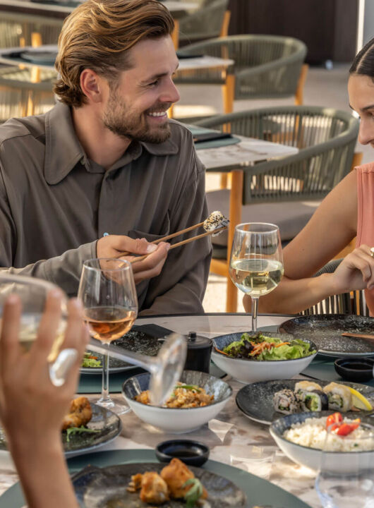 Guests enjoying Japanese dining experience at Fiki restaurant in Paphos