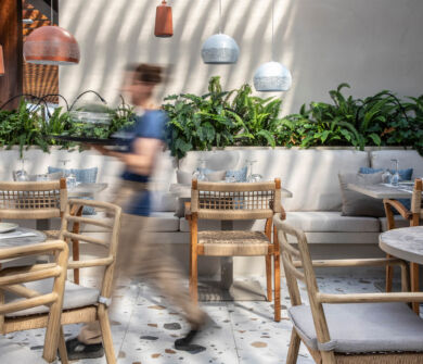Waiter walking through at Kerkyra Blue restaurant
