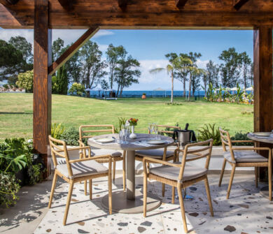 Outdoor tables ready for dinner at Kerkyra Blue restaurant