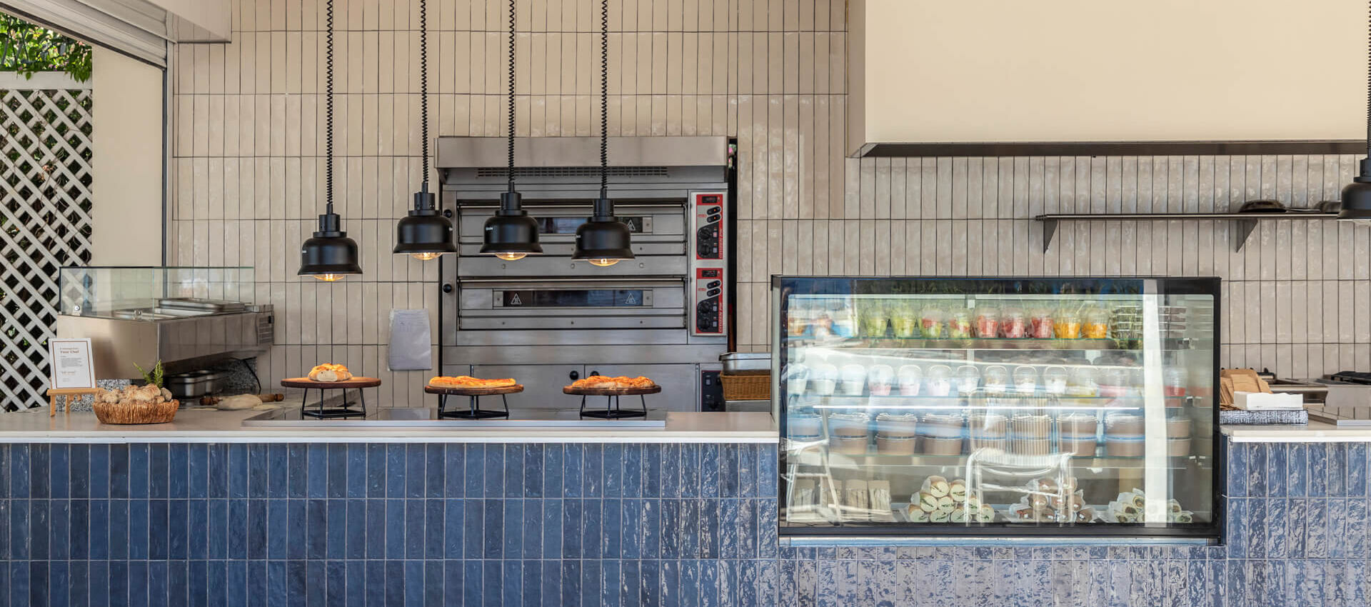 Kerkyra Blue Restaurant fridge with snacks and pizza