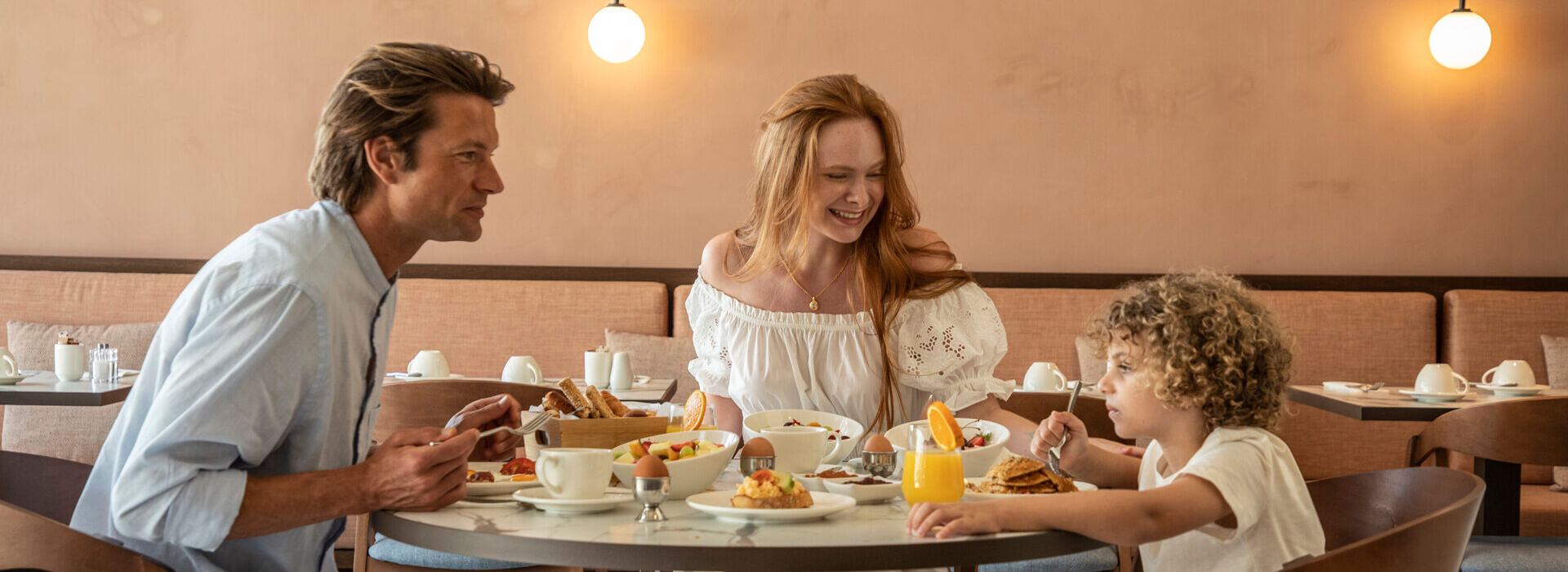 Family eating breakfast at Kerkyra Blue Hotel restaurant