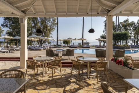 Outdoor tables and sitting area at Kerkyra Blue