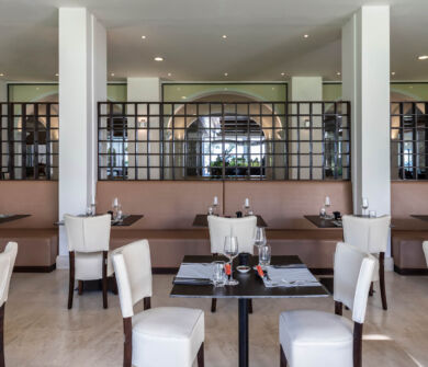 tables ready for dinner at Kerkyra Blue Fiki restaurant