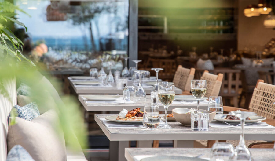 Tables prepared for dinner at Kerkyra Blue restaurant