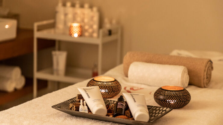 Spa oils and creme on top of massage bed at Kerkyra Blue Spa