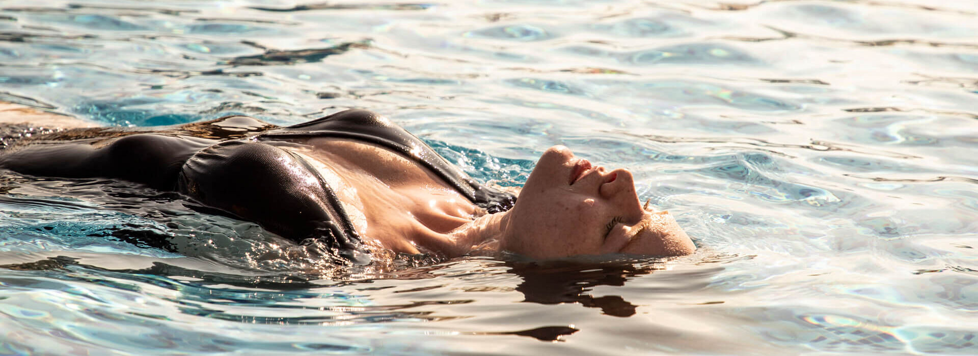 Woman Swimming at Kerkyra Blue pool