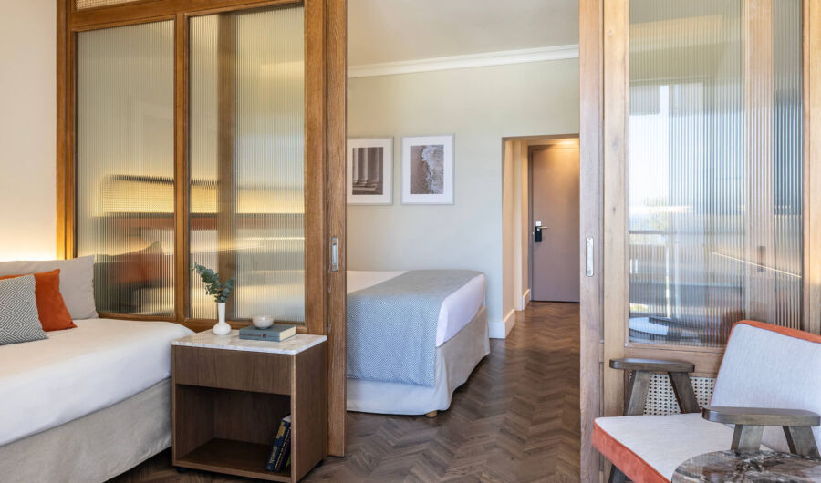 Kerkyra Blue Superior Triple Room sitting area and bedroom