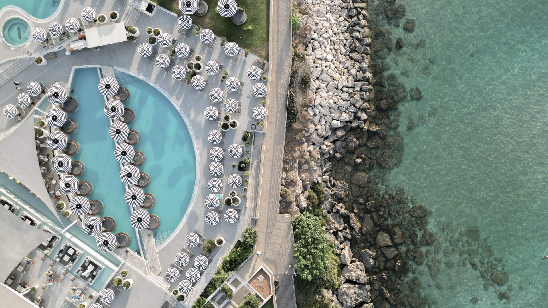 King Jason Protaras pool with sunbeds and umbrellas and sea