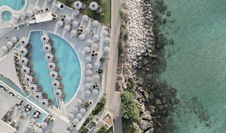 King Jason Protaras pool with sunbeds and umbrellas and sea