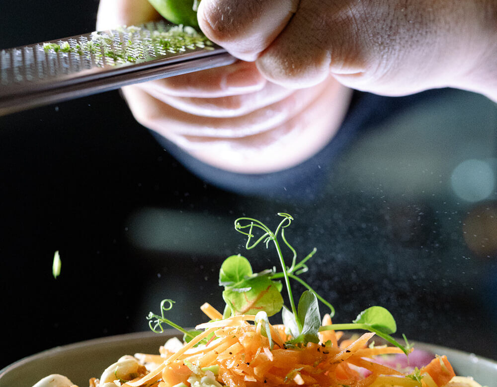 chef plating dish at King Jason Zante restaurant