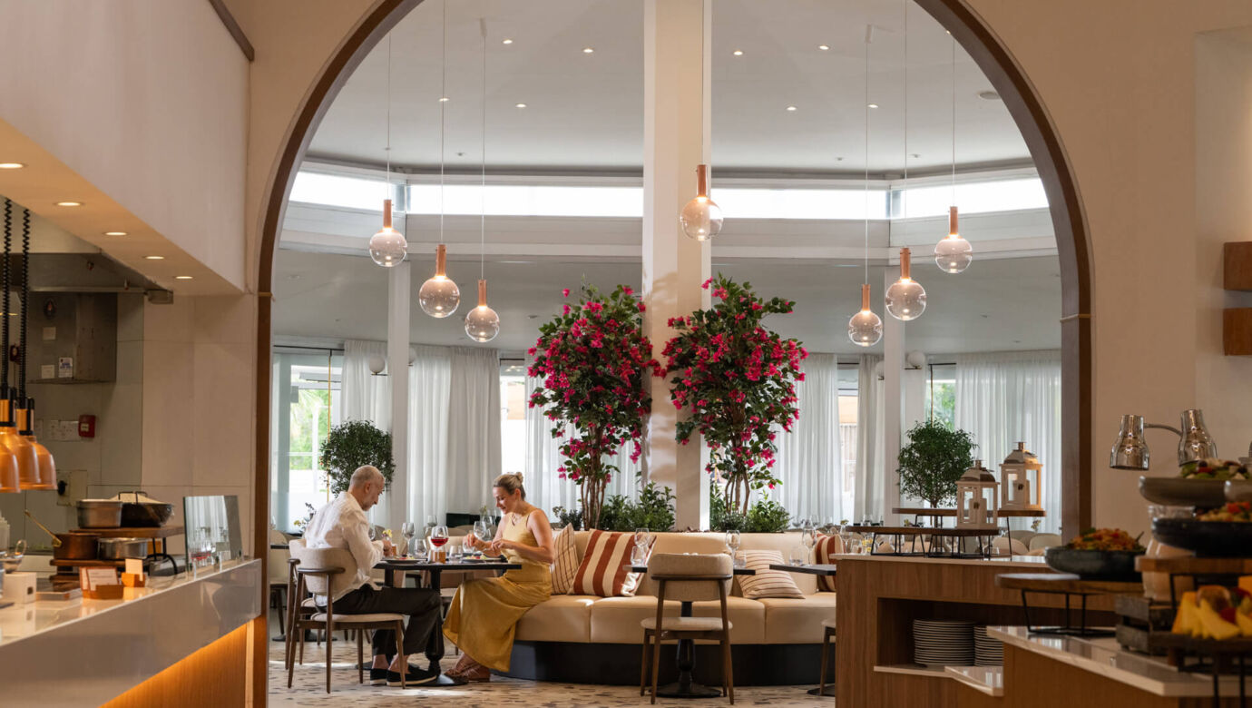 Couple eating sitting at inside table dining at King Jason Paphos restuarant