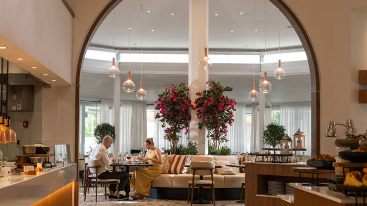 Couple eating sitting at inside table dining at King Jason Paphos restuarant