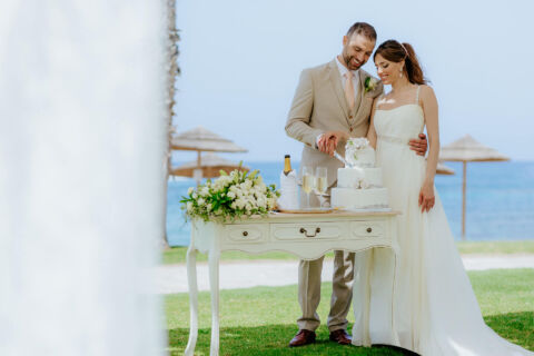 Couple Cutting cake at Louis Ledra Beach