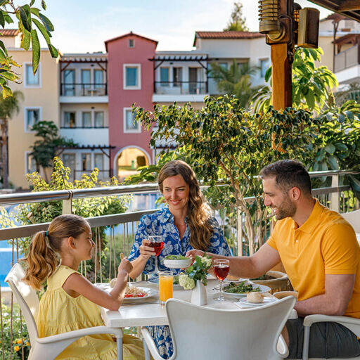Family eating at Louis Althea Hotel