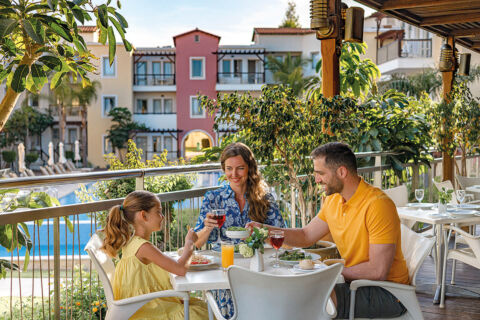 Family eating at outside restaurant of louis Althea