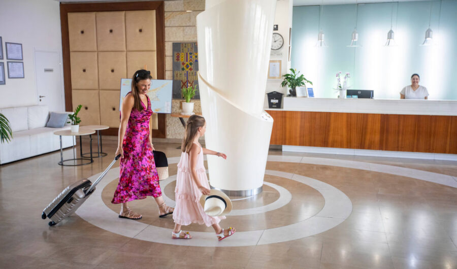 Mother and daughter walking through reception at Louis Althea Reception