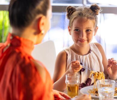 Mother with daughter eating at Louis Althea restaurant