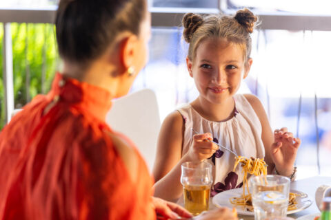Mother with daughter eating at Louis Althea restaurant