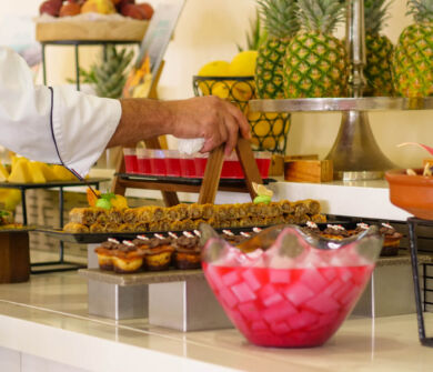 Cook preparing buffet at Louis Althea restaurant