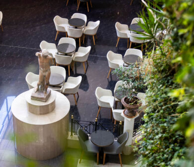 Statue and tables at Louis Pheathon Atrium Bar