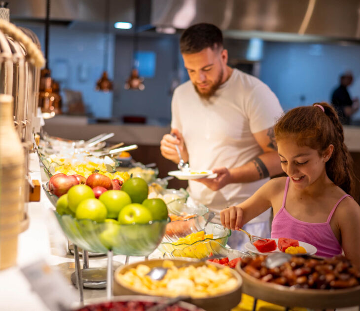 Louis Ledra Anemi restaurant family serving themselves from buffet