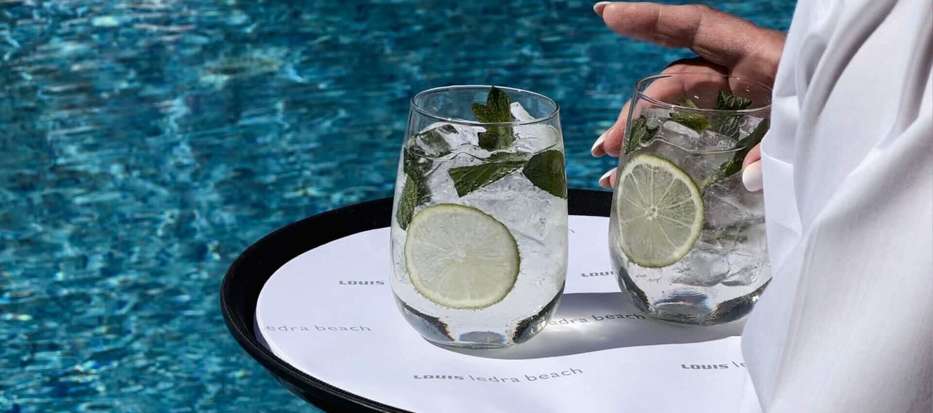 Louis Ledra Beach waiter serving cocktails