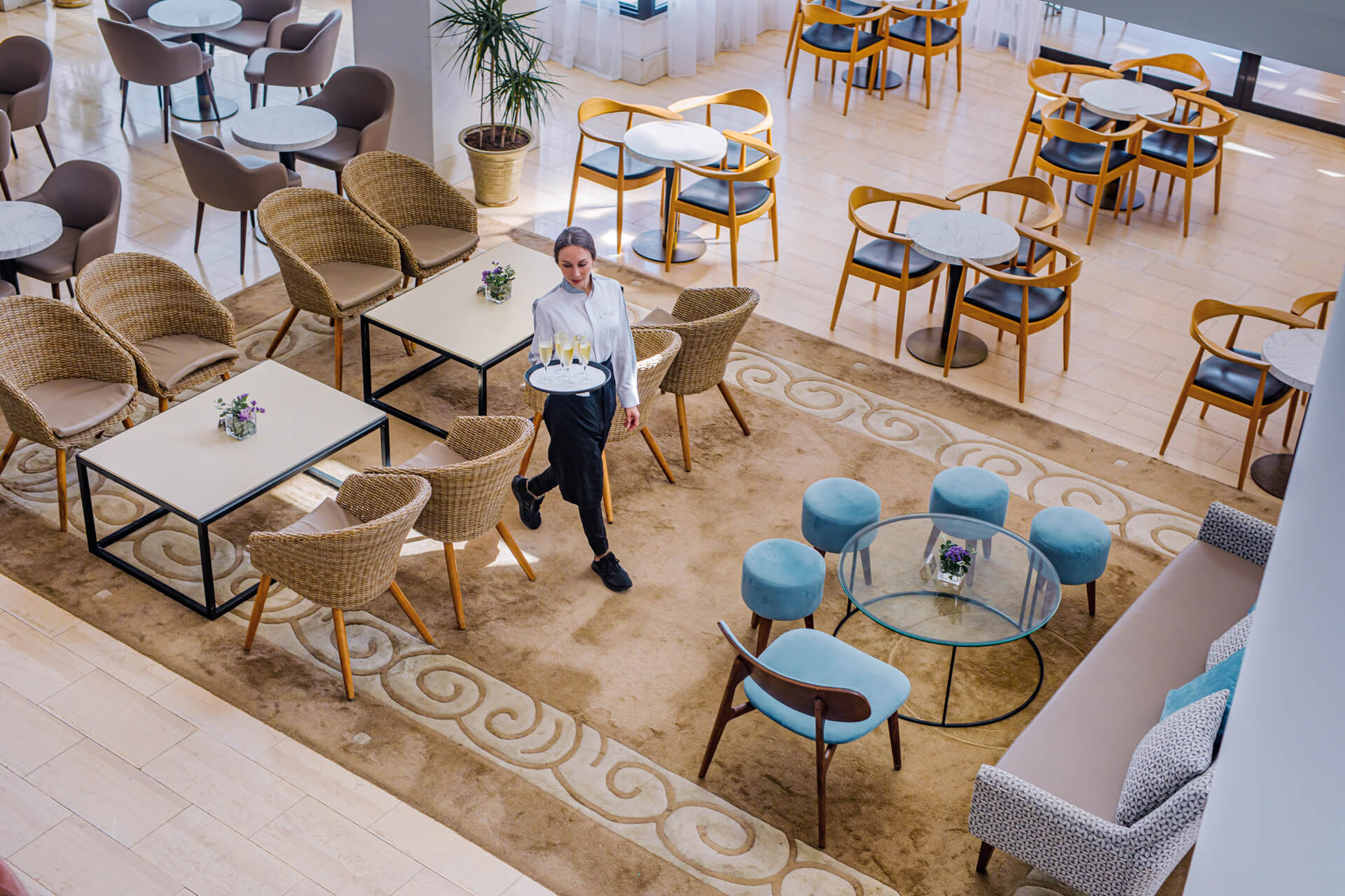 Waiter walking through Louis Ledra Gazebo Restaurant