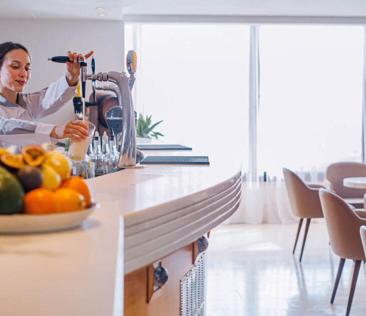 Waiter preparing a glass of beer at Waiter Louis Ledra Gazebo Restaurant