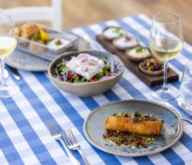 Table with appetizers and wine at Louis Nausicaa taverna