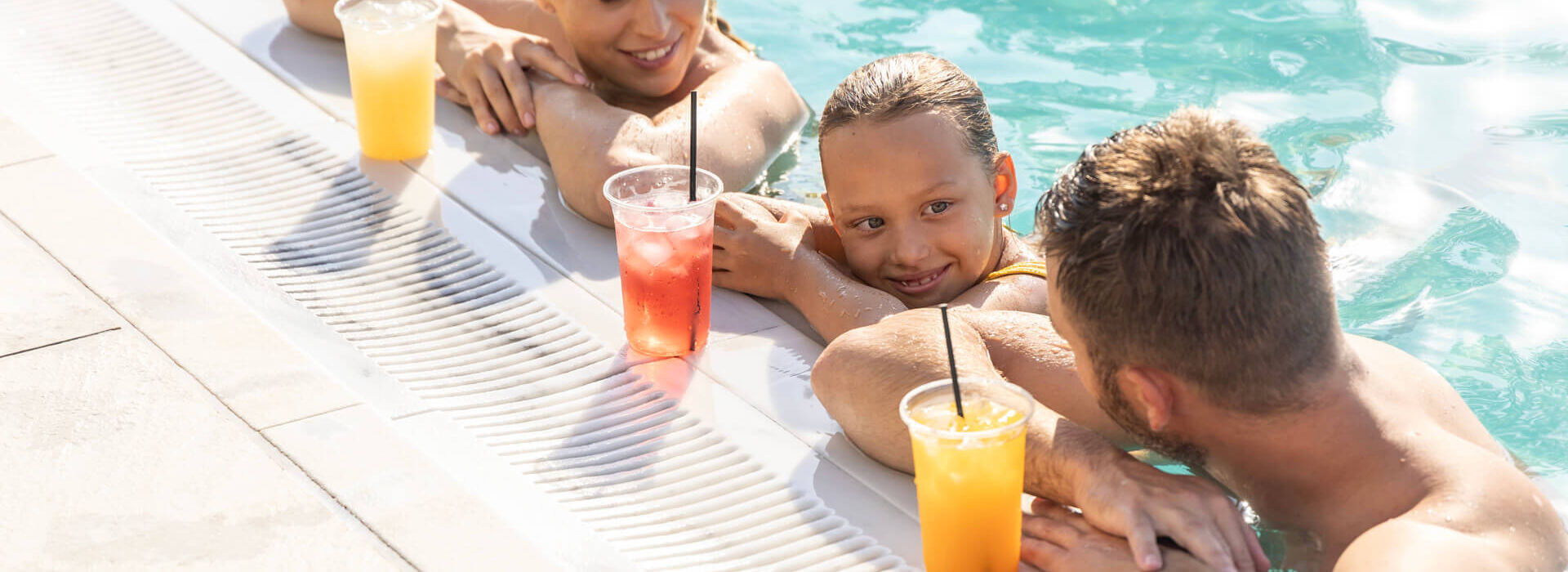 Family swimming and having drinks at Louis Nausicaa pool