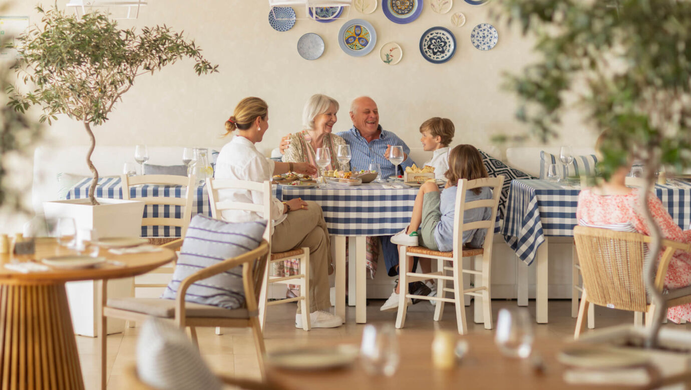 Family eating at Louis Nausicaa Taverna restaurant