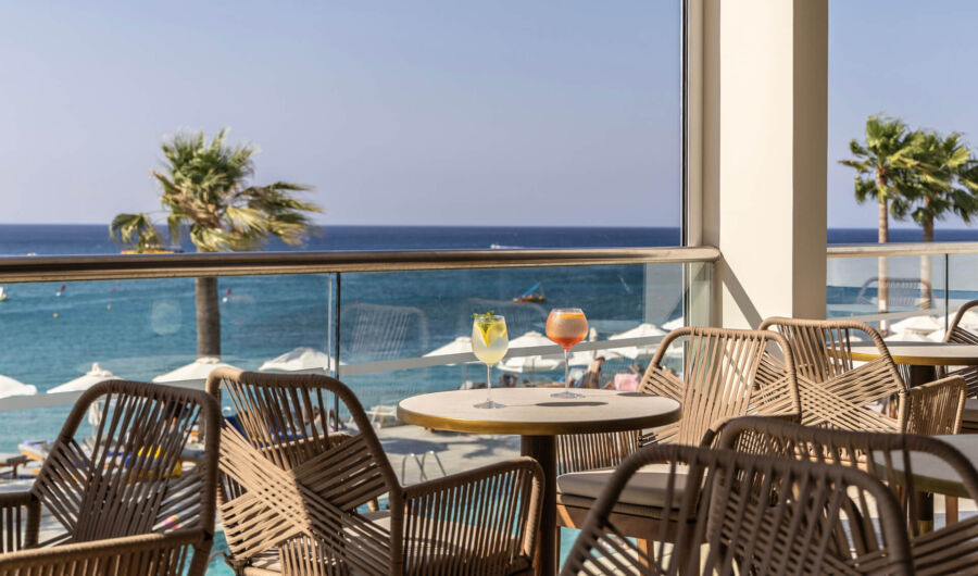 Drinks at a table at Louis Nausicaa Thea bar with sea view