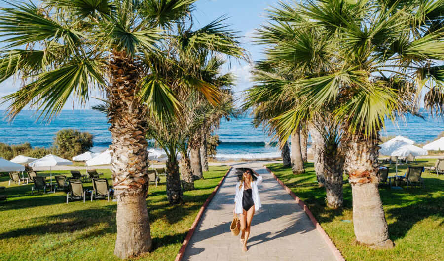 Woman in swimsuit walking at Louis Paphos Breeze