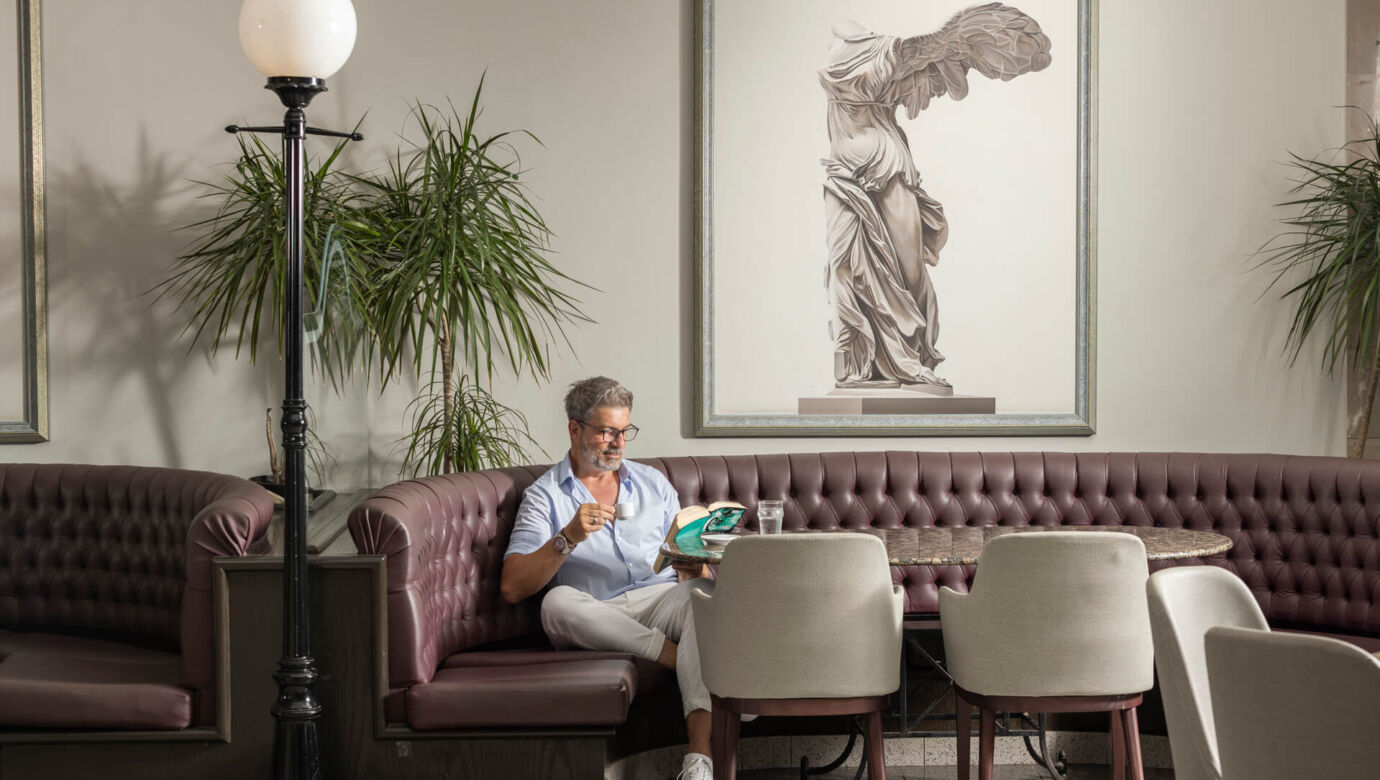 Man reading book at Louis Phaethon