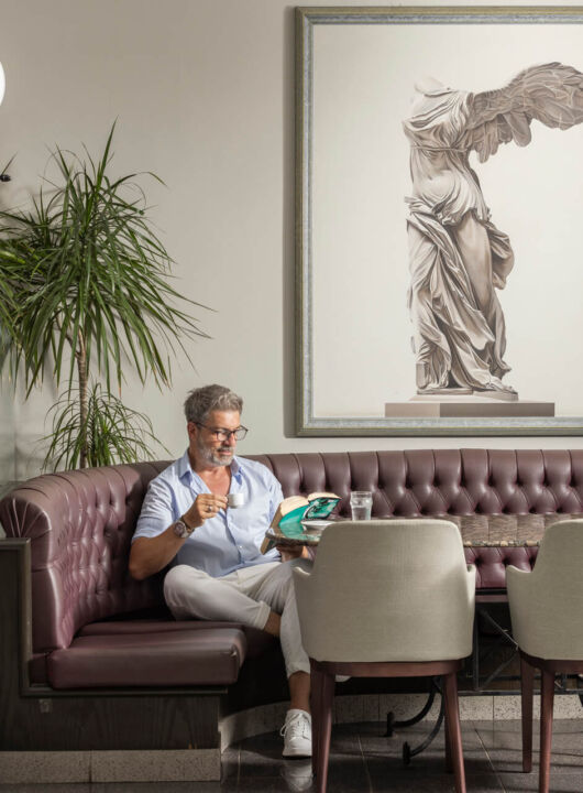 Man reading book at Louis Phaethon
