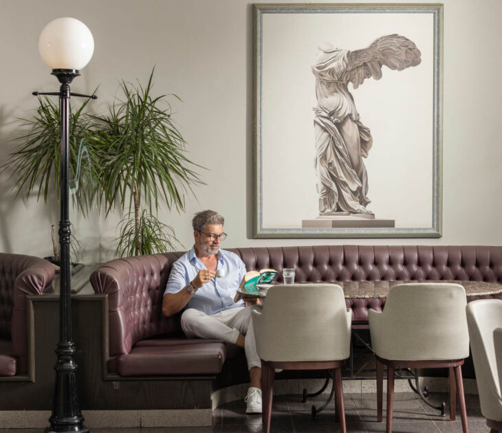Man reading book at Louis Phaethon