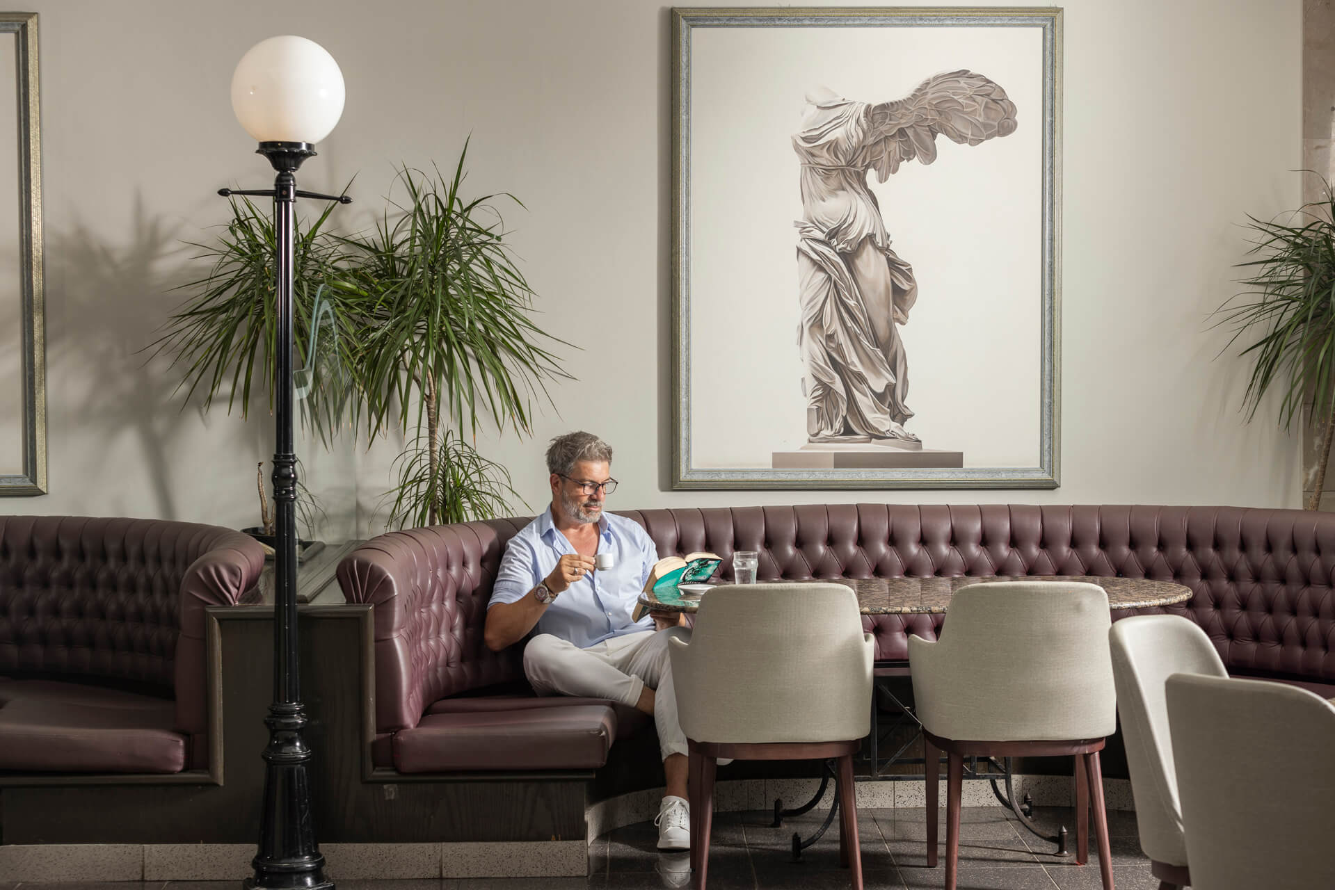 Man reading book at Louis Phaethon