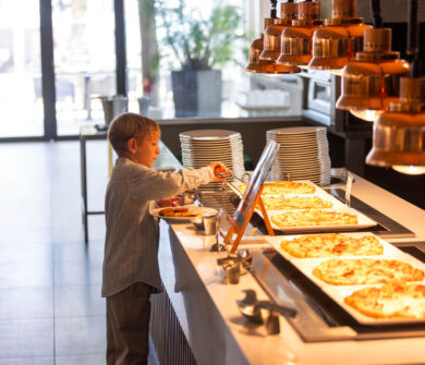 Child getting pizza at Louis Phaethon Esperides Restaurant buffet