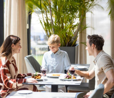 Family at a table with food at Louis Phaethon Esperides Restaurant
