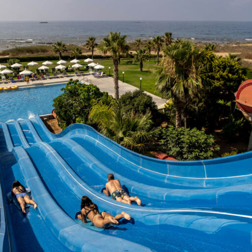 Family going down a slide at Louis Phaethon water park