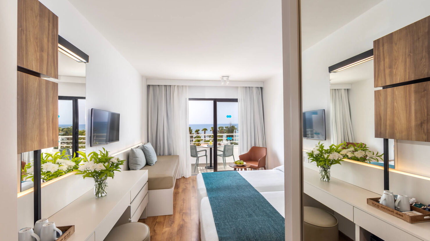 Louis Phaethon twin room bedroom and balcony with sea view