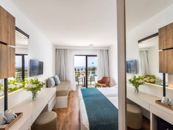 Louis Phaethon twin room bedroom and balcony with sea view