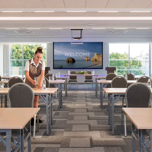 Woman preparing the Sofianna Resort Meetings space