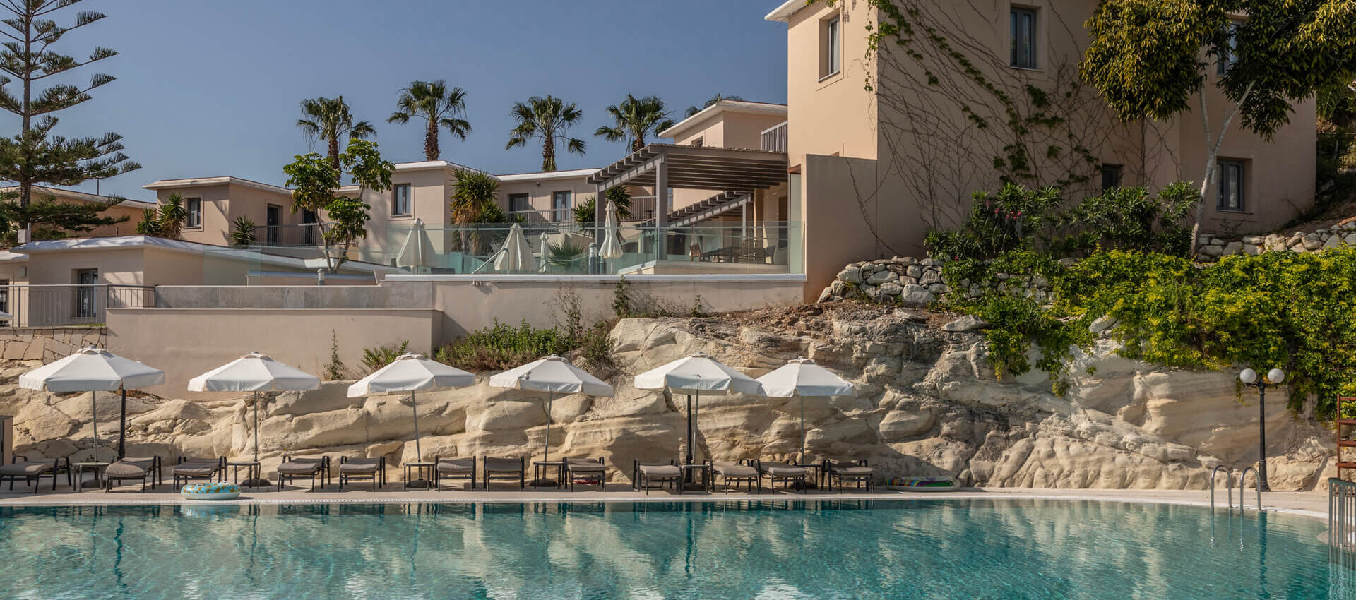 St,Elias Pool and building with sunbeds