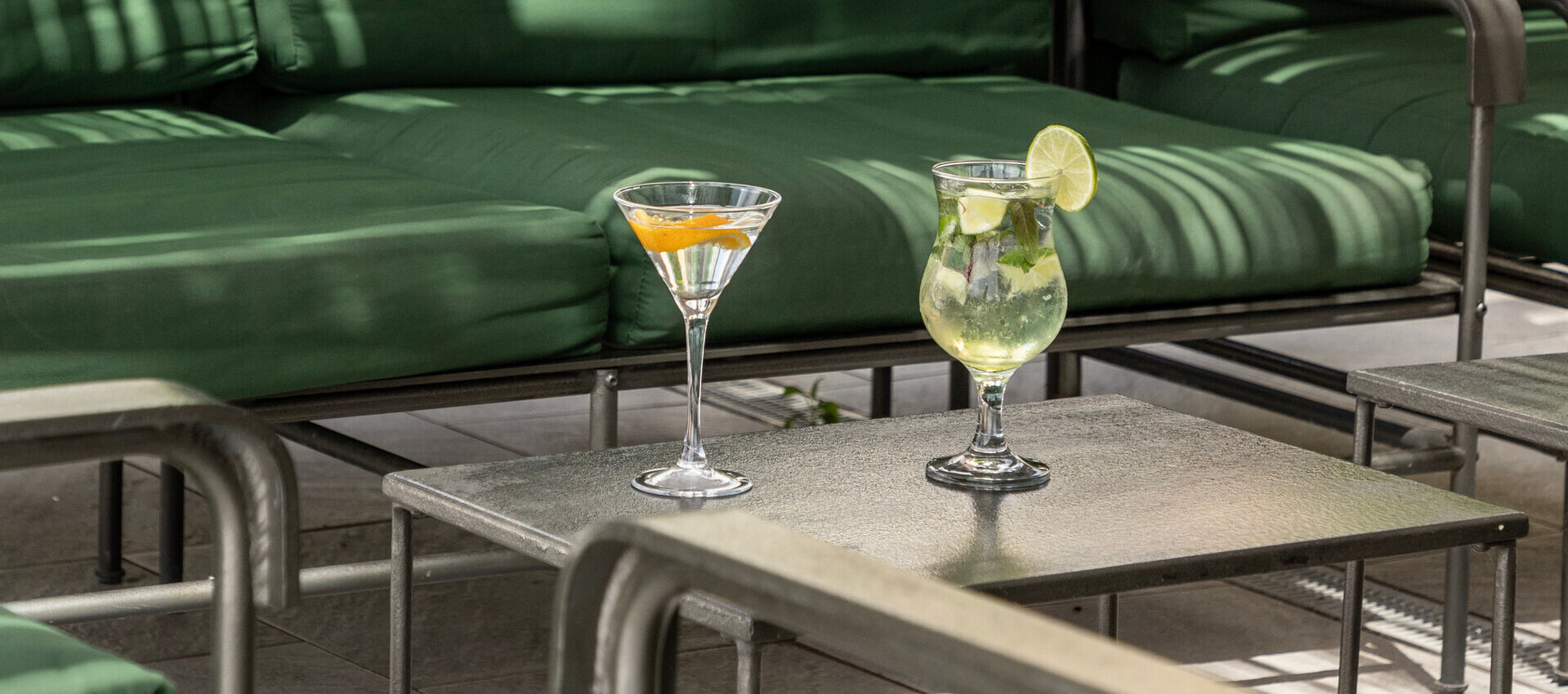 Table with two coktails at St. Elias jacaranda bar